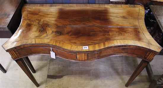 George III inlaid and cross-banded mahogany side table, of serpentine form, fitted two frieze drawers(-)